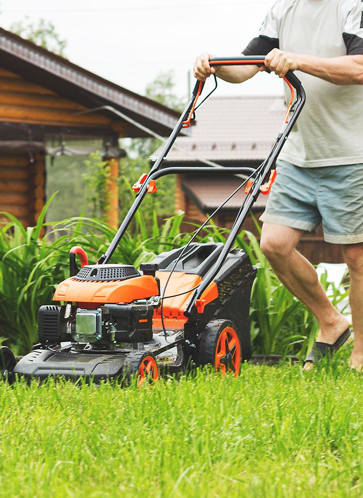 Man mowing his lawn.